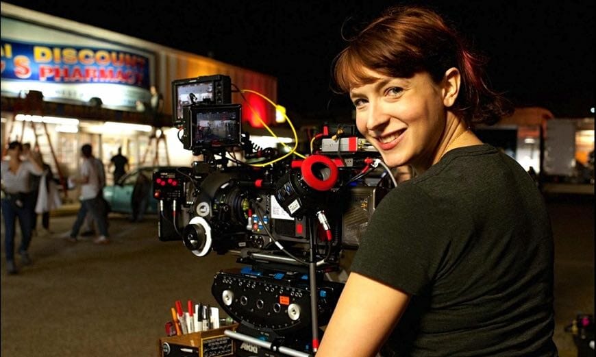 Diablo Cody standing behind a movie camera on a set