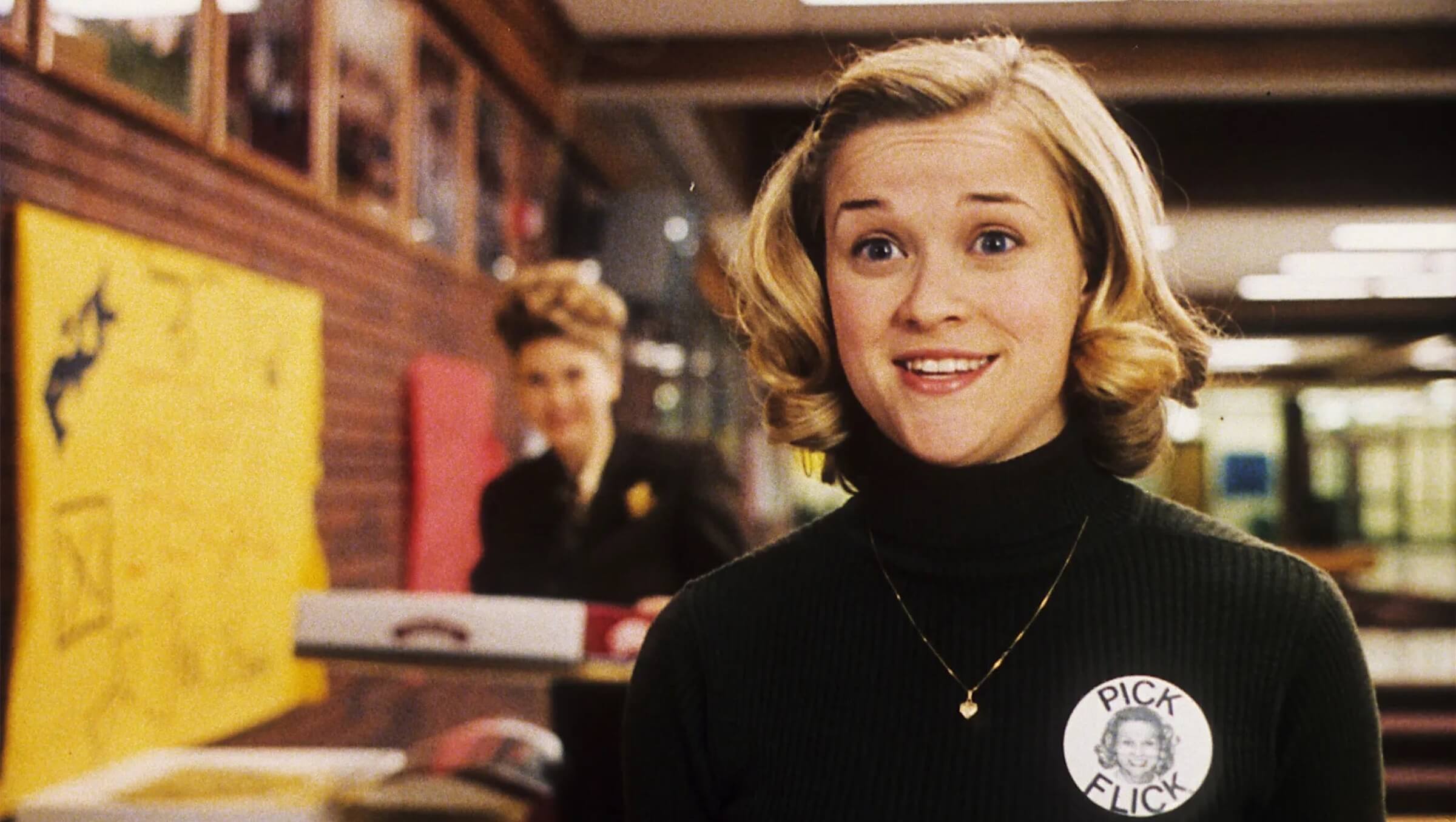 Tracy Enid Flick (Reese Witherspoon) in a black turtleneck talking to a teacher in 'Election'