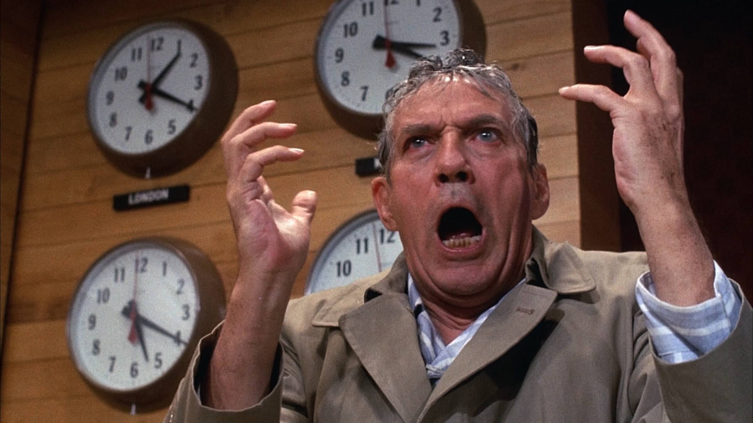 Howard Beale (Peter Finch) screaming behind the new table in 'Network,' Moving Monologue: The Best Movie Monologues That Leave Audiences Speechless