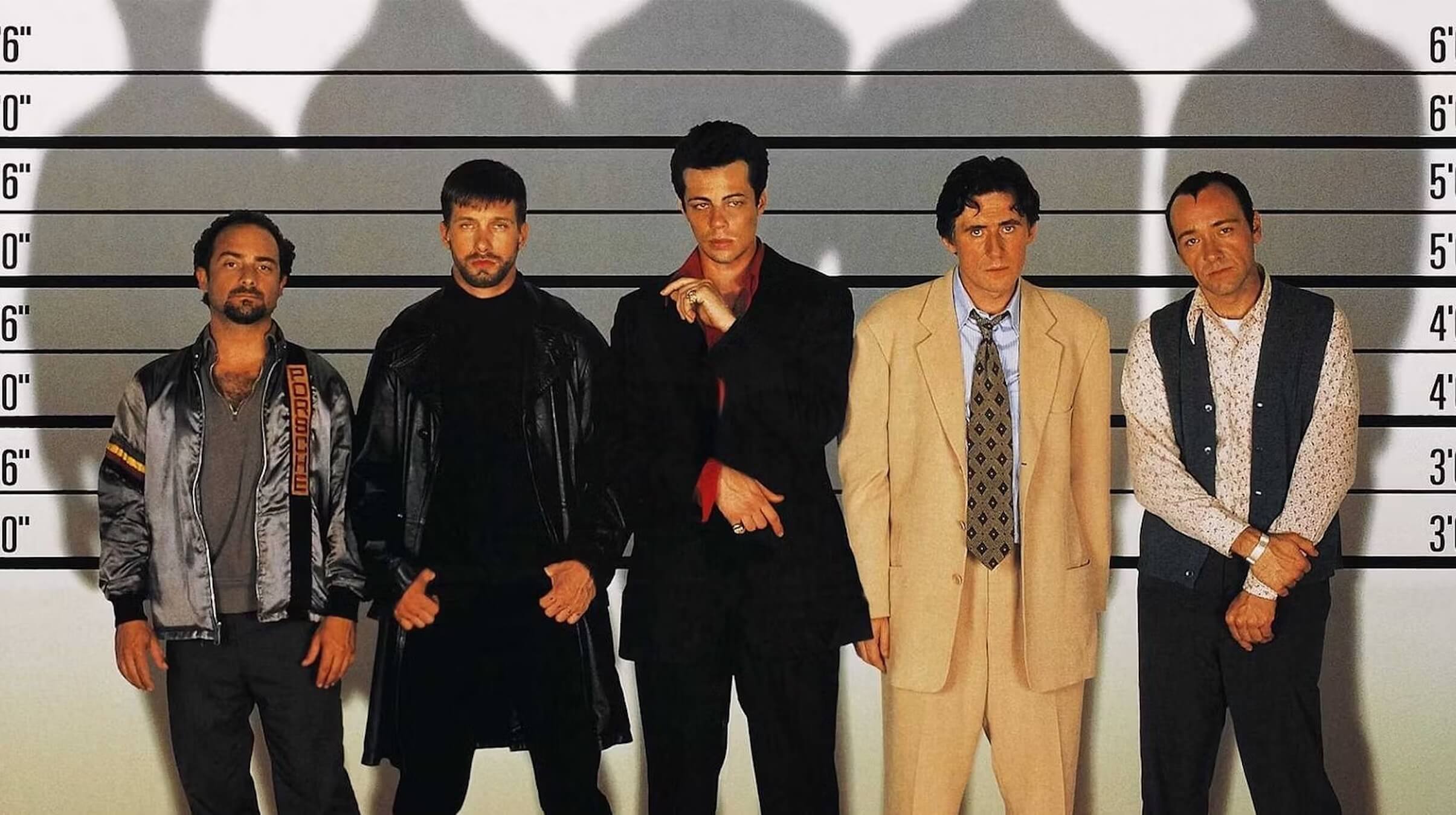 The cast of 'The Usual Suspects' standing against a wall with measurements; The Dark Side of Cinema: Uncover the Masterpieces of Film Noir