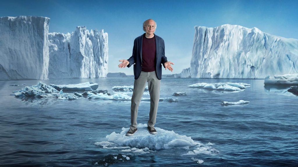 Larry David standing on a block on ice in 'Curb Your Enthusiasm,' The Comedy of Circumstance: Sitcoms That Give Us Side Stitches