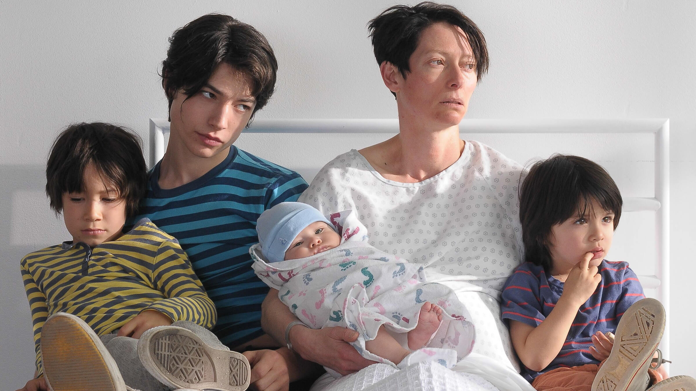 Eva Khatchadourian (Tilda Swinton) looking at her young son in 'We Need to Talk About Kevin,' Unbreakable Bonds: Powerful Portrayals of Motherhood in Movies