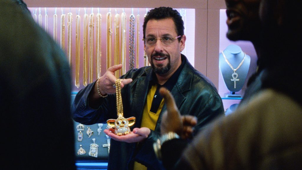 Howard Ratner (Adam Sandler) showing off a diamond necklace in 'Uncut Gems,'