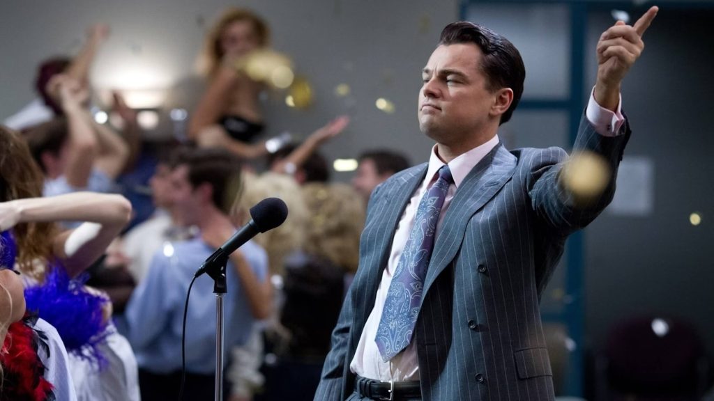 Leonardo DiCaprio as Jordan Belfort celebrating in an office in 'The Wolf of Wall Street'