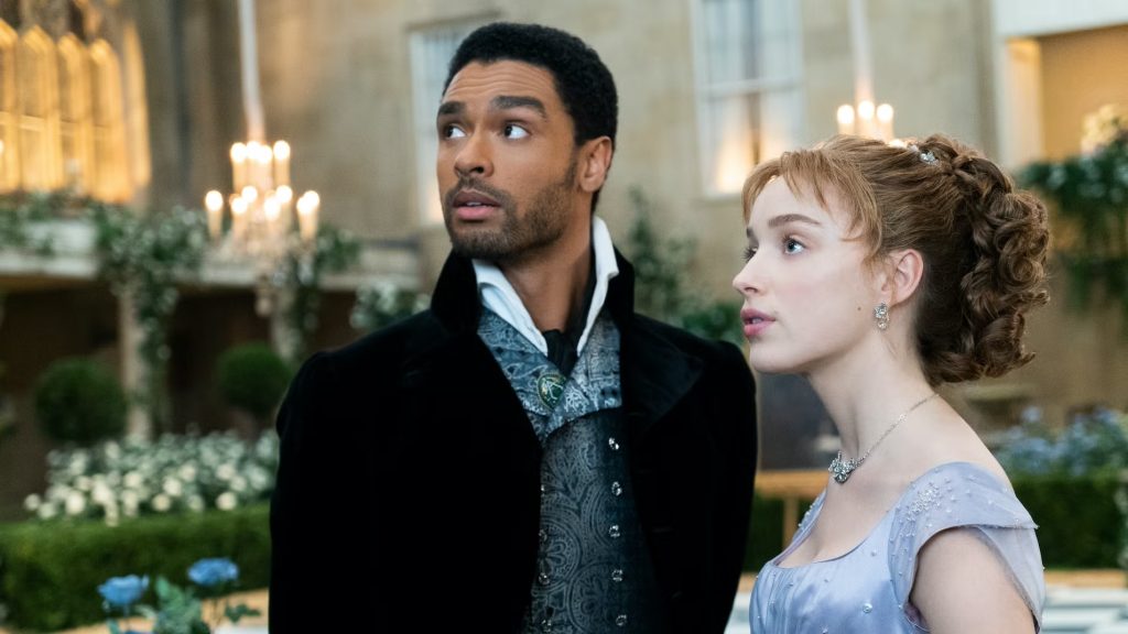 Daphne (Phoebe Dynevor) and Simon (Regé-Jean Page) at a ball in 'Bridgerton'