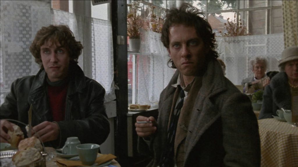 Withnail (Richard E. Grant) and "...& I"/Marwood (Paul McGann) sitting in pub in 'Withnail and I'